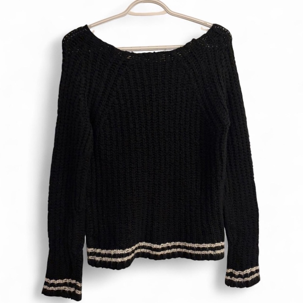 Black and white striped sweater with off-the-shoulder detail